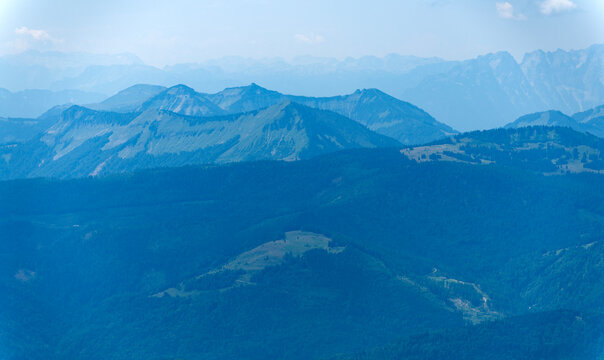 Aerial view of mountain landscape. Landscape panorama. Dramatic misty landscape with mountain in nature environment. Snow mountain peak aerial view. Aerial misty landscape
