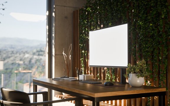Computer PC Blank Screen in Modern Home Office Workspace with Vertical Garden and Concrete Walls
