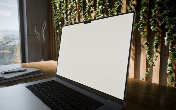 Laptop with Frame Less Blank Screen in Modern Concrete Workspace with Laptop and Vertical Garden