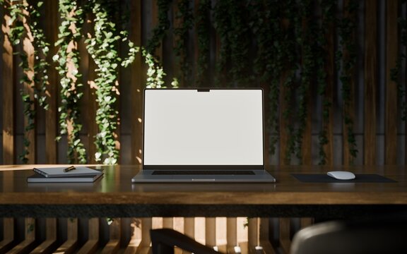 Laptop with Frame Less Blank Screen in Modern Concrete Workspace with Laptop and Vertical Garden