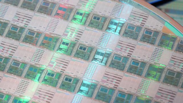 High-tech Macro Photography of a Colorful Silicon Wafer with Microchip Patterns for AI Hardware and Semiconductor Industry Concept.
