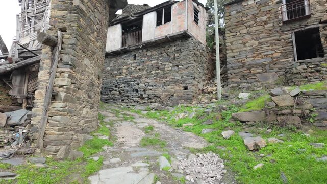 Ruined stone houses in Santoalla do Monte, Galicia, Spain, documenting the abandonment and rural depopulation of the remote mountain settlement.