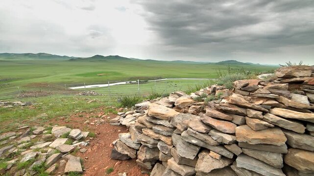 Shiveet Ulaan excavation site in Mongolia showing animal style stone sculptures and ruins.
