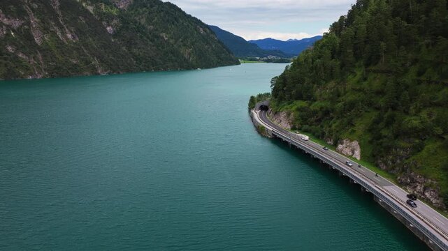 Achen Lake - Road Winding Along The Edge Of Turquoise Water And Mountain Cliffs At Lake Achensee In Austria