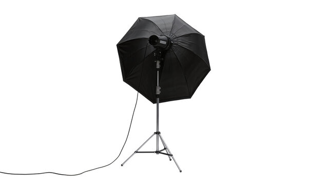 Black photographic umbrella with studio light on tripod, isolated on transparent background