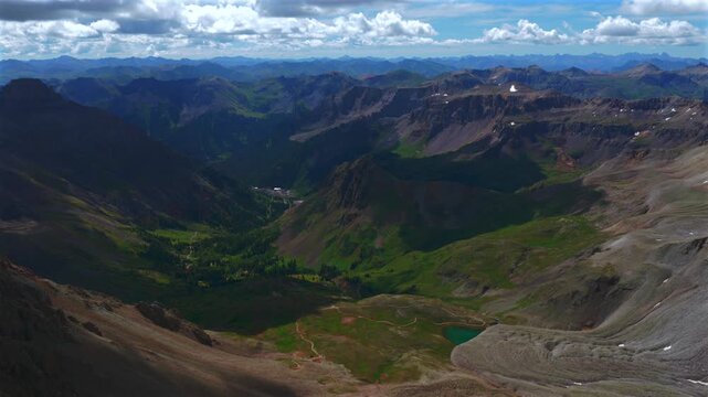 Yankee Boy Basin Blue Lakes trail Wrights Lake Mount Sneffels Wilderness summit 14er landscape drone aerial Colorado San Juan Range Rockies Stony Mountains morning sunny clouds blue sky forward pan up