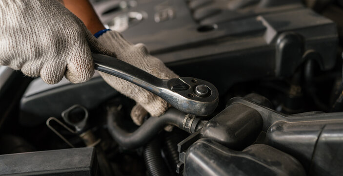 Generated Team Auto mechanic are checking and repair maintenance auto engine is problems at car repair shop.