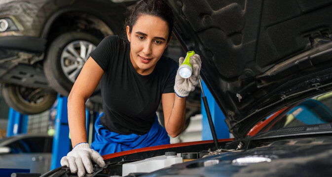 Generated Team Auto mechanic are checking and repair maintenance auto engine is problems at car repair shop.
