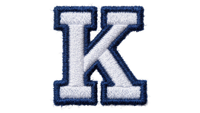 Embroidered blue and white letter K patch, isolated on transparent background