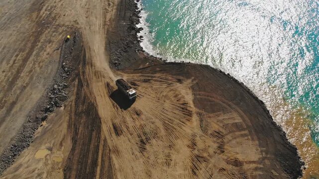 Rize Turkey sea reclamation works show coastal airport construction, trucks, earthmoving.