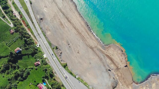 Rize Turkey sea reclamation works show coastal airport construction, trucks, earthmoving.