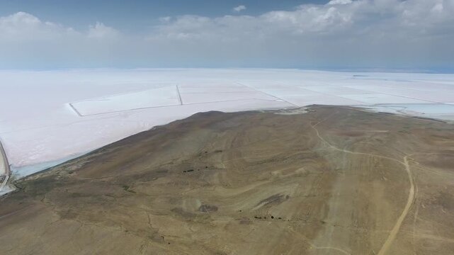 Aerial saltworks reveal evaporation ponds, levees, roads, and industrial basins beside Tuz Golu.
