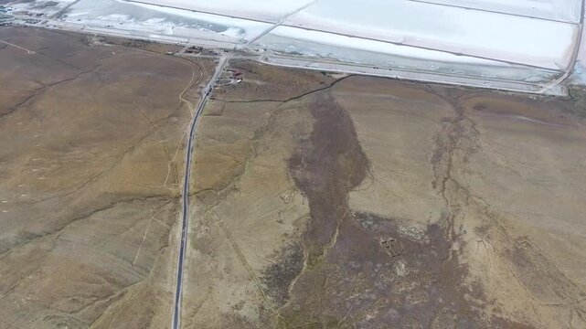 Aerial saltworks reveal evaporation ponds, levees, roads, and industrial basins beside Tuz Golu.