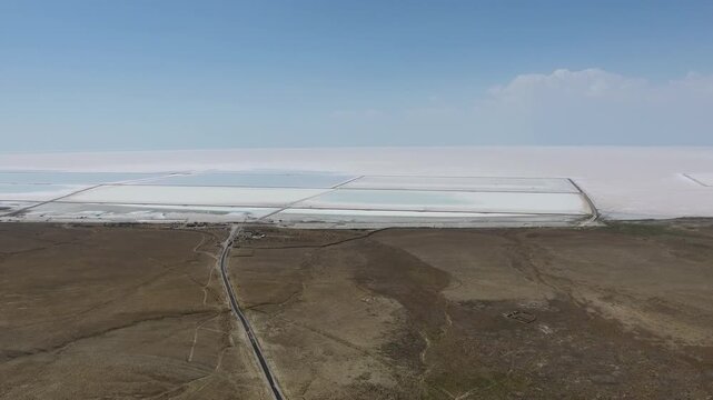 Aerial saltworks reveal evaporation ponds, levees, roads, and industrial basins beside Tuz Golu.