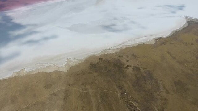Pink Tuz Golu in Turkey shows mineral rich saline water and salt flats before sunset.