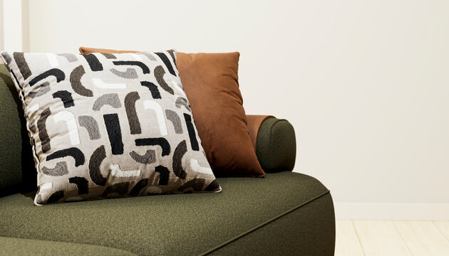 Decorative pillows on green modern sofa in living room