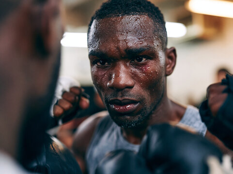 Intense Sweaty Boxer Focusing During Tough Sparring Match