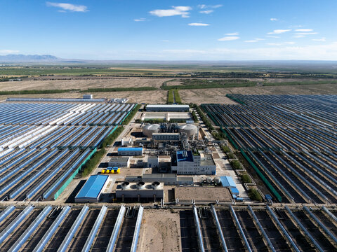 Panoramic view of a large scale parabolic trough CSP power plant in the desert