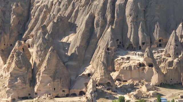 Aerial views sweep across Cappadocia fairy chimneys, valleys, and eroded tuff landscapes.