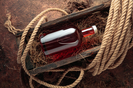 Bottle of hard liquor in a vintage wooden box.