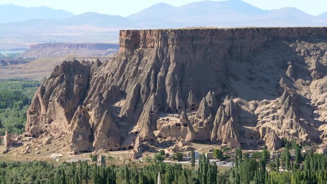 Aerial views sweep across Cappadocia fairy chimneys, valleys, and eroded tuff landscapes.