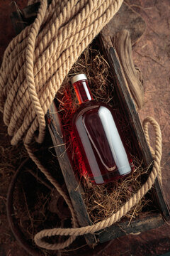 Bottle of hard liquor in a vintage wooden box.