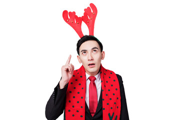 Surprised Businessman Wearing Reindeer Antlers and Festive Scarf Pointing Up © LuuDieu