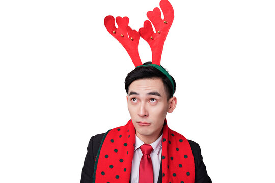 Bored Businessman Wearing Reindeer Antlers and Festive Scarf
