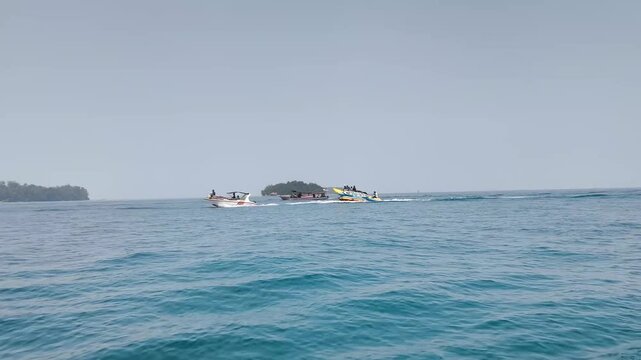 Clear blue sea with small island view in distance in Thousand Islands