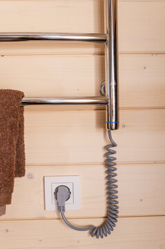 Energy-efficient electric towel warmer provides bathroom heating, dry towels, moisture control and convenient household living vertical