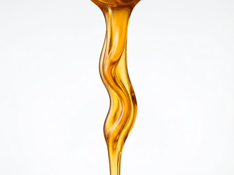 Honey pouring photo, golden syrup liquid stream flowing on white background, sweet food concept