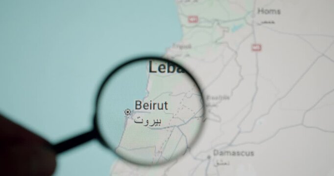 Close-up view of a magnifying glass moving over a digital map, focusing on the city of Beirut, the capital of Lebanon, with its name written in both english and arabic script
