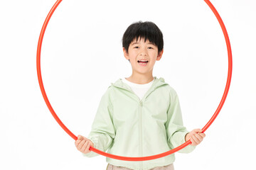 Happy boy holding a red hula hoop © CaoBaoTran