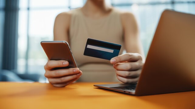 A Person Using A Smartphone And Credit Card For Online Financial Transactions