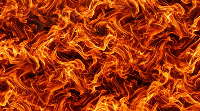 Intense fiery flame texture background with burning blazing inferno orange and yellow fire tongues, hot natural element energy conceptual photography design