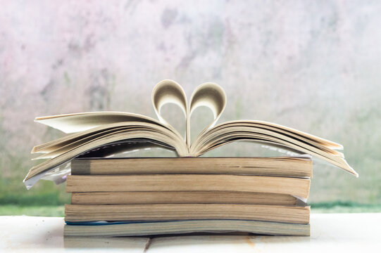Concept of love for reading and education with book heart,