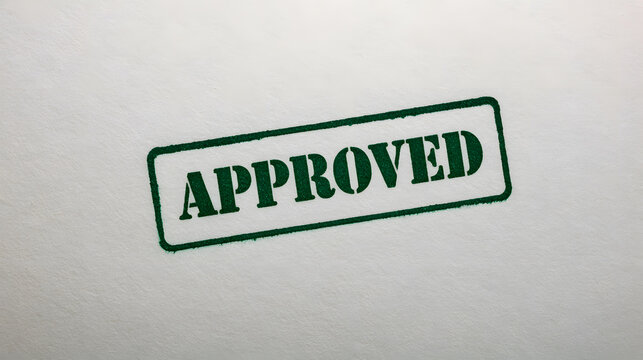Green approved stamp on white document