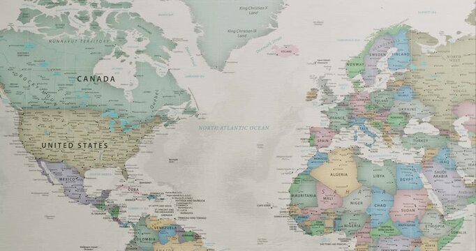 Colorful political map of the world slowly panning from the United States and Canada to Europe, Africa, and Asia, showing all the countries with their borders, capitals, and major cities