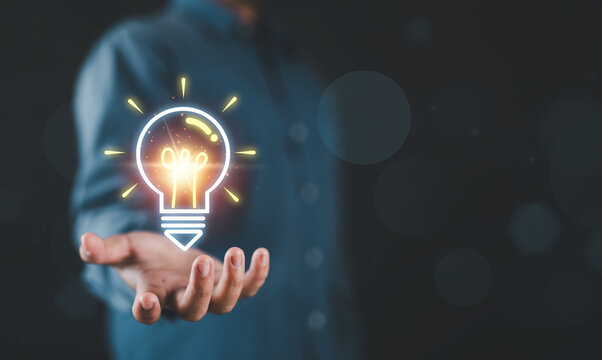Creative idea innovation concept with glowing light bulb in hands, symbolizing inspiration, problem solving, smart thinking and business creativity for generating solutions and driving success.