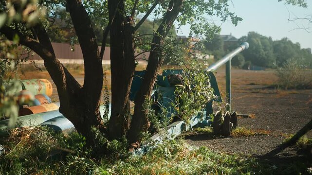 
Obsolete, abandoned, and rusty combat guns stand amidst the natural landscape. A graveyard of weaponry. An echo of war.
