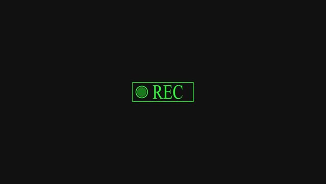 Green recording indicator icon with a small circle and text on a dark background showing that a video camera is currently filming or capturing media content for digital broadcast production