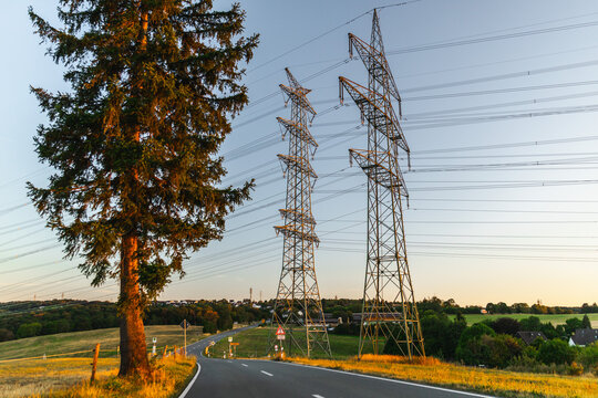 Rural German Road Beneath High-Voltage Power Pylons