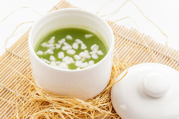 Pearl and Jade Nourishing Soup Served in a White Porcelain Bowl © 徐 建亮