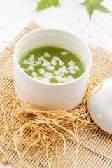 Pearl and Jade Nourishing Soup Served in a White Porcelain Bowl © 徐 建亮