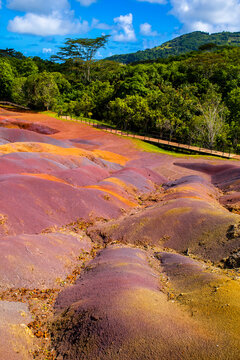 Chamarel Seven Colored Earth Geopark in Mauritius Island. Colorful panoramic landscape about this volcanic geological formation Chamarel Seven Colored Earth Geopark in Riviere noire district.
