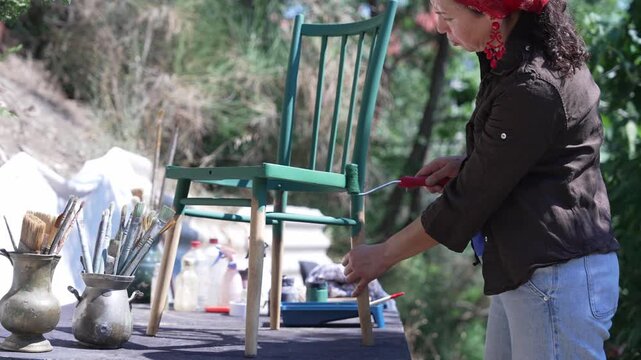 Woman Restoring Chair Using Traditional Craft Skills