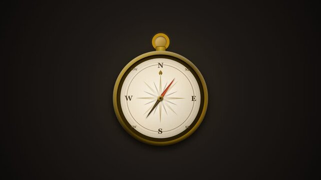 Vintage golden navigation compass isolated on a dark background.