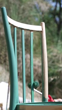 Woman Upcycling Old Furniture with Paint