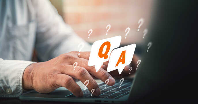 Question and Answer Q&A Concept with Businessman Typing on Laptop Keyboard.
