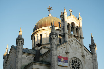 Fototapeta premium Church of St. Michael the Archangel on Belavista Square in the Old Town of Herceg Novi, Montenegro, featuring Byzantine, Gothic and Romanesque architectural elements